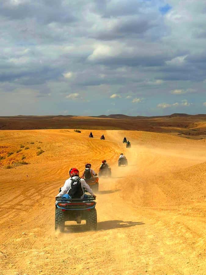 Agafay tour Quade Bike, Sunset and Romantic Dinner Show - Quad biking across rocky desert tracks