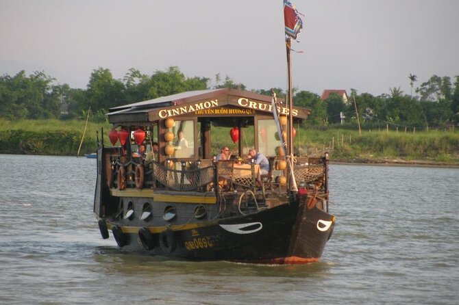 Experience Romantic Sunset Dinner Cruise in Hoi An - Watching Hoi An from the outdoor deck