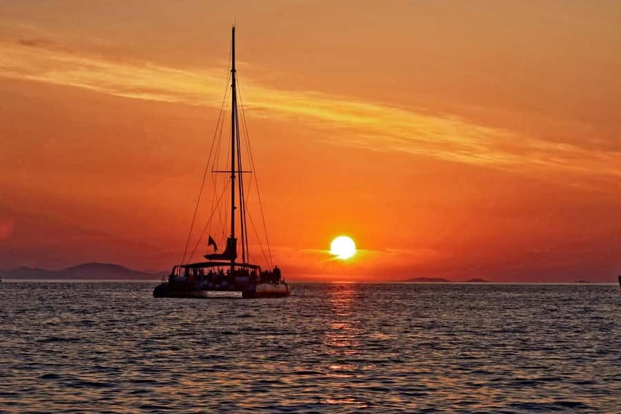 Grand Bay: Honeymoon/Lovers Sunset Tour with Romantic Dinner - Meeting the catamaran at Grand Baie