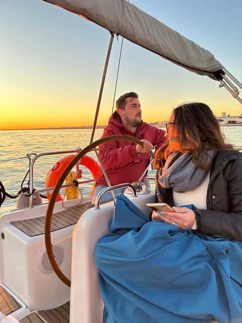 Lisbon: Romantic Cruise with Wine & Portuguese Tapas - Taking the helm and setting the pace