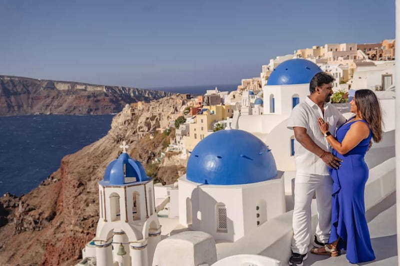 Oia: Couple Photoshoot Seprate Entrance to Blue Dome - Oia’s blue-dome setting