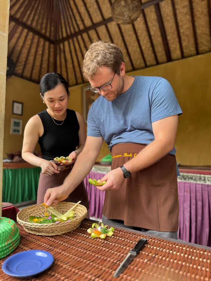 packages cooking class and romantic dinner in a local home - Making a Balinese offering before cooking