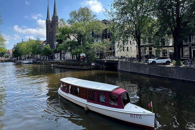 Romantic Private Boat Tour Amsterdam 90min incl welcome drink - A building supported by wooden pillars