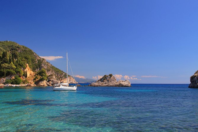 Shared Catamaran Romantic Sunset Cruise from Santorini via Volcano - White Beach and its pale volcanic cliffs
