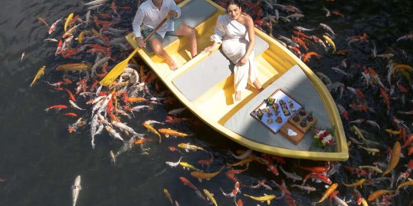 Ubud: The Original Koi Fish Yellow Boat Photo Moment - Sparkling wine, coffee, and fish feeding