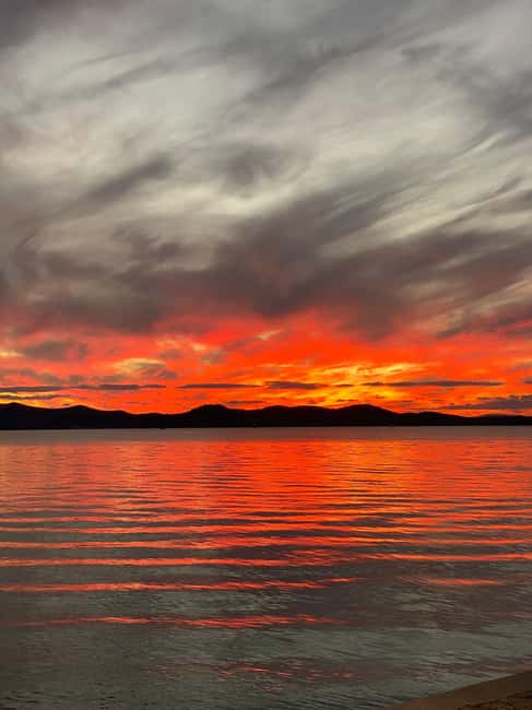 Zadar: Romantic Sunset Boat Tour with Champagne - Passing beneath the bridge and leaving the harbor